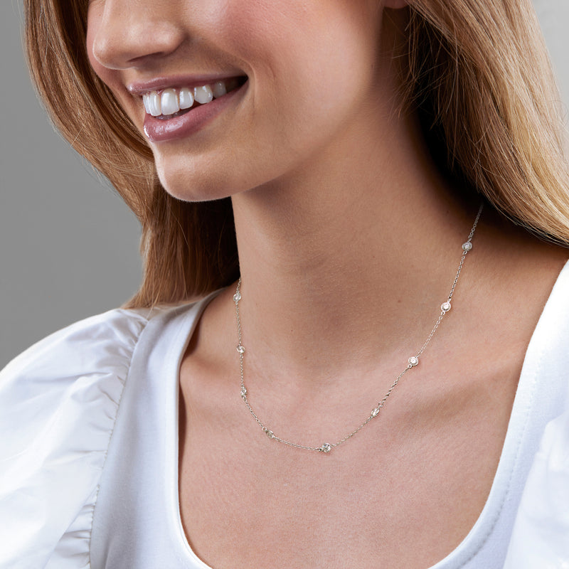 Sterling silver station necklace with small round crystal links