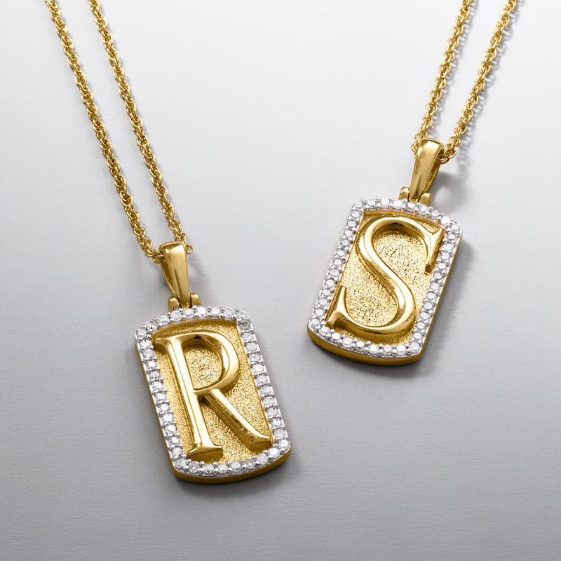 Two 18kt gold over sterling dog tag initial pendants with diamond-inset R and S
