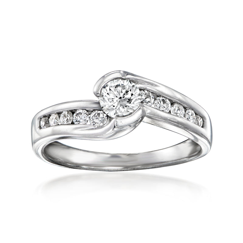 Vintage 14kt white gold diamond ring with round center stone and pavé side stones