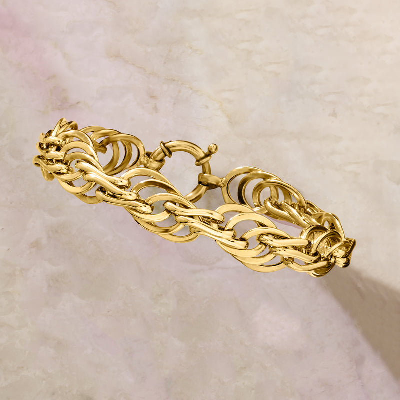 Gold-tone multi-oval link bracelet, angled view with round clasp