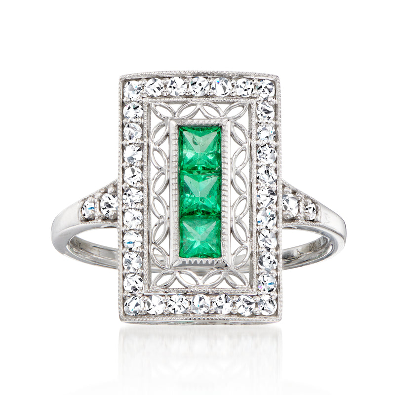 Vintage 14kt white gold ring with rectangular green emerald center and diamond halo