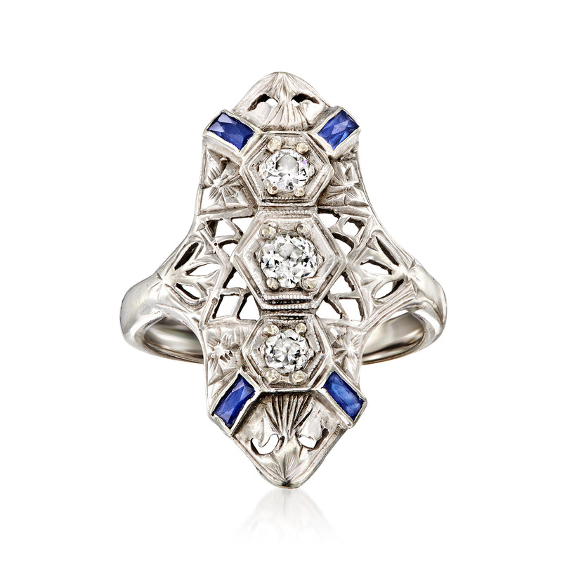 Vintage 18kt white gold ring with round center diamond and blue sapphire side stones