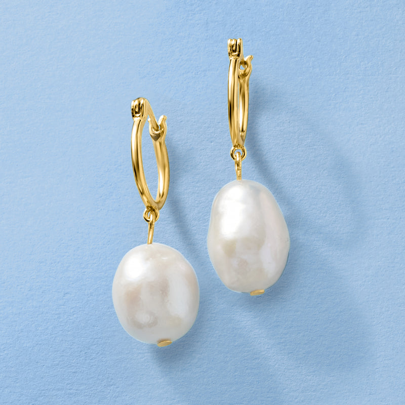 Gold-tone hoop drop earrings with white baroque cultured pearls, angled view
