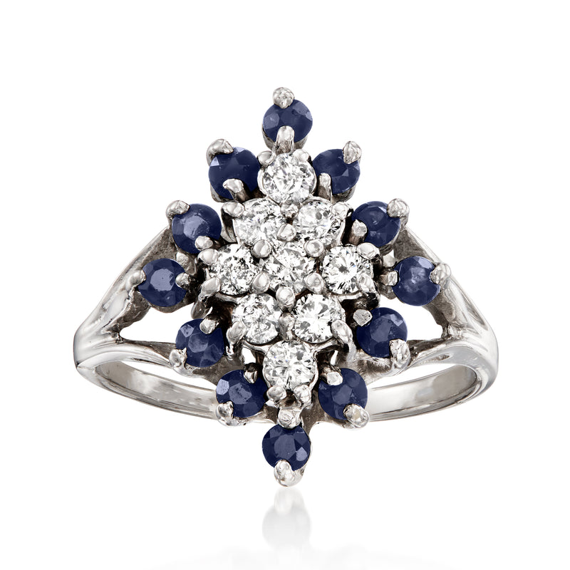 Vintage 14kt white gold cocktail ring with diamond cluster center and blue sapphire halo