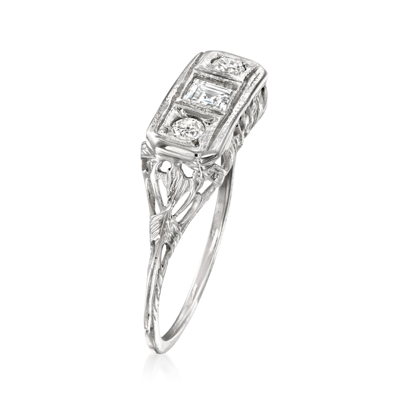 White gold diamond ring with rectangular cluster top and filigree sidework, raised setting