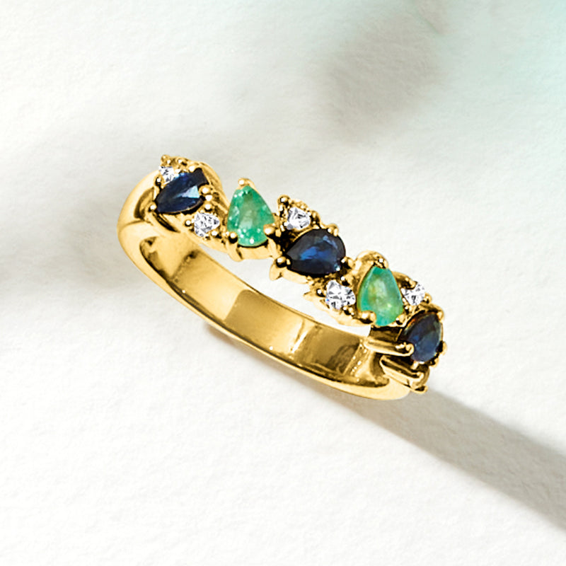 Gold over sterling ring with alternating blue sapphires, green emeralds, and white topaz