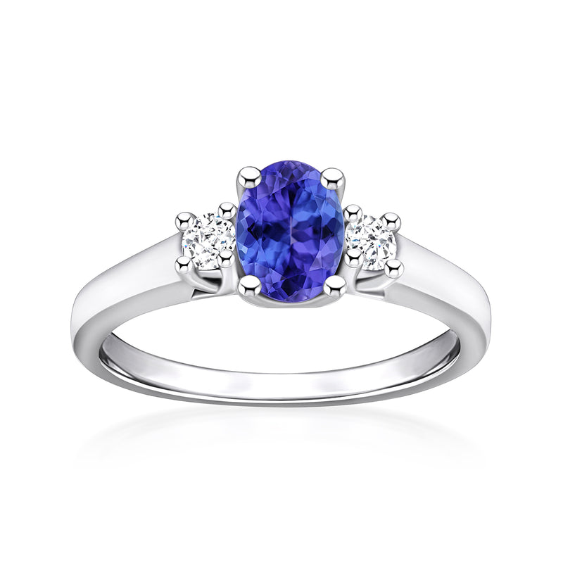 Oval tanzanite center stone with round diamond accents in white gold ring