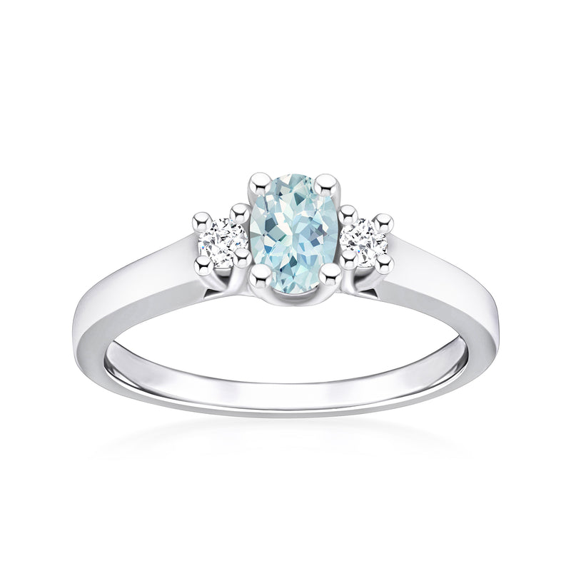 Oval aquamarine and round diamond ring in 14kt white gold, slim band.