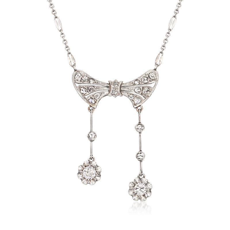 Platinum diamond bow necklace with two dangling round drop charms