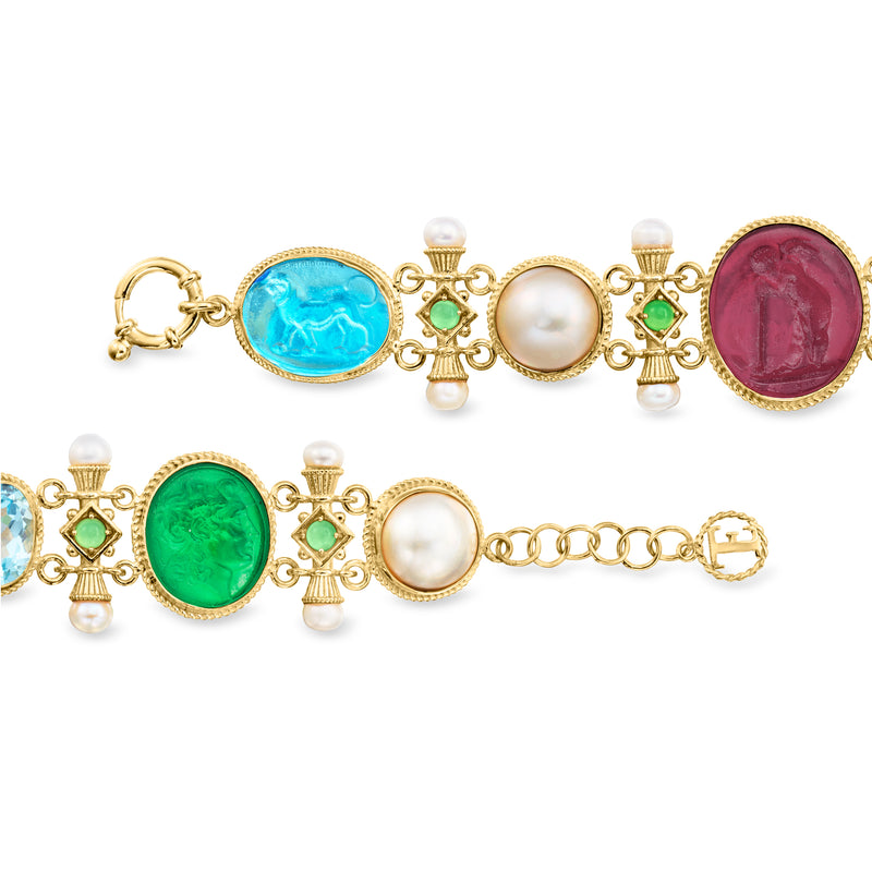 Multicolor gold-tone bracelet featuring blue, green, red, and white glass cabochons, pearls