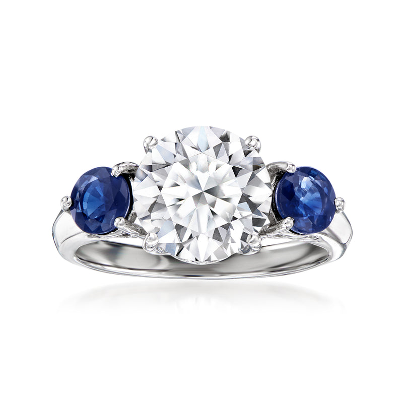 14kt white gold ring with round lab-grown diamond center and blue sapphire side stones