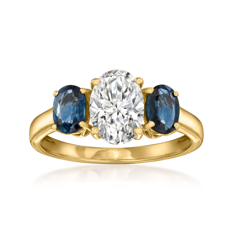 14kt yellow gold ring with oval blue sapphires and round lab-grown diamond center
