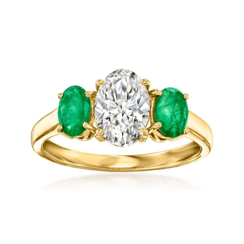 14kt yellow gold ring with oval center lab-grown diamond and three green emerald stones