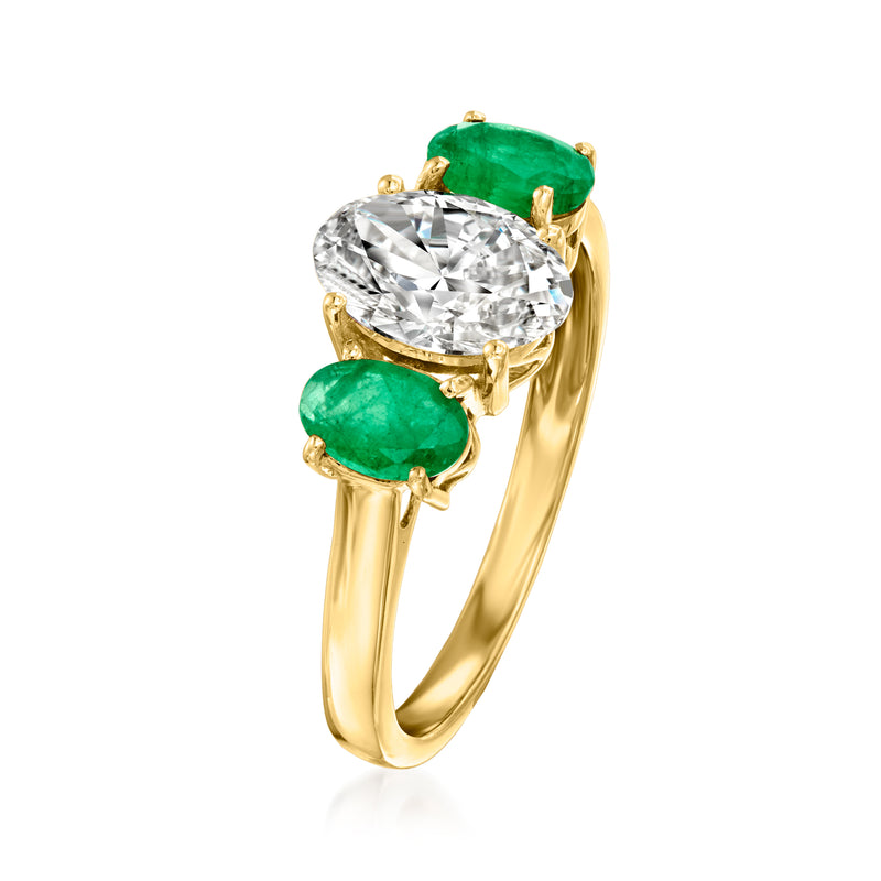 14kt yellow gold ring, side view: oval lab-grown diamond with three green emerald stones