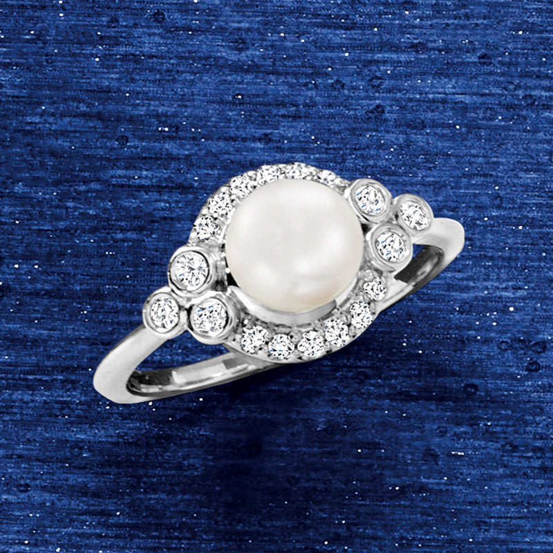 Cultured pearl and diamond halo ring in 14kt white gold with round center pearl