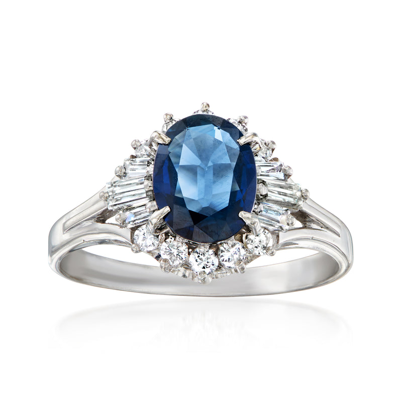 Platinum ring with oval blue sapphire center and baguette diamond side accents
