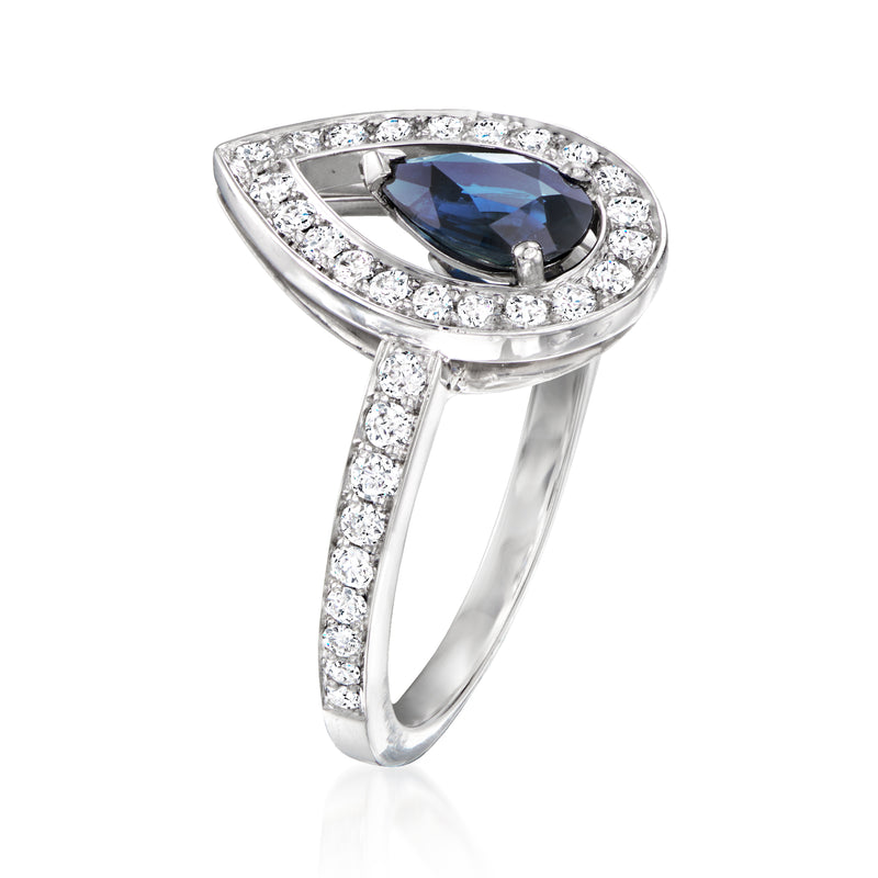 Platinum ring with pear-shaped blue sapphire and diamond halo