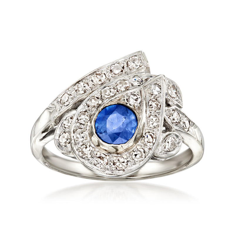 Vintage 14kt white gold ring with oval blue sapphire and diamond halo