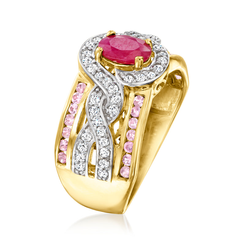 Gold ring showing side: pink stones and white clusters around a red oval center