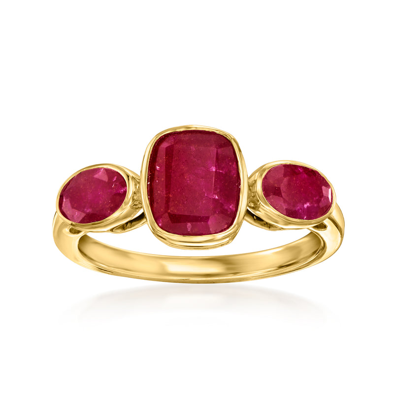 Three-stone ruby ring in gold with three oval rubies, bezel-set