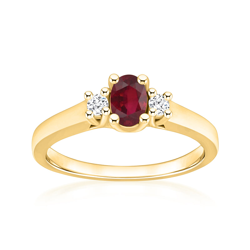 14kt yellow gold ring with oval red ruby center and round diamond accents