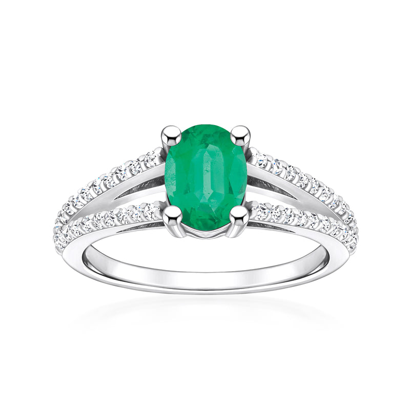 Oval emerald ring with diamond accents in white gold