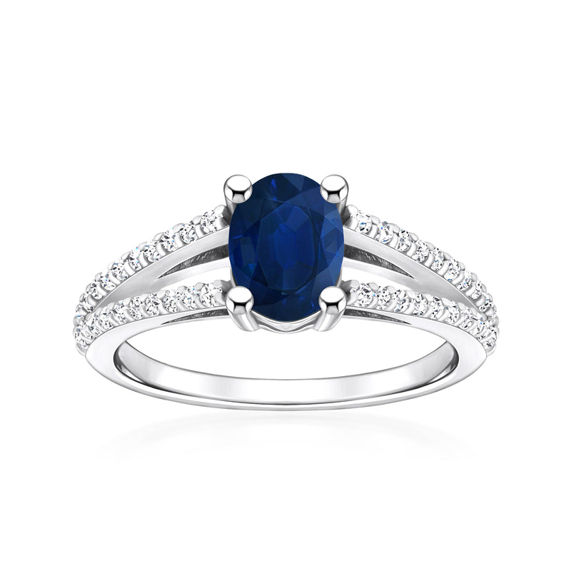 Sapphire ring with oval blue center stone and diamond accents in white gold
