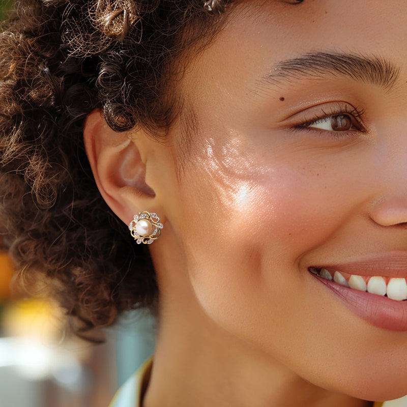 Cultured pearl and diamond leaf stud earrings with post, shown on model