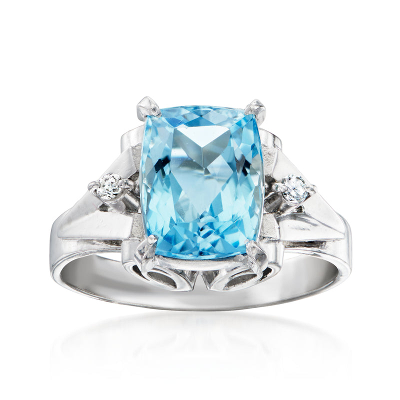 Platinum ring with large aquamarine cushion center stone and diamond accents