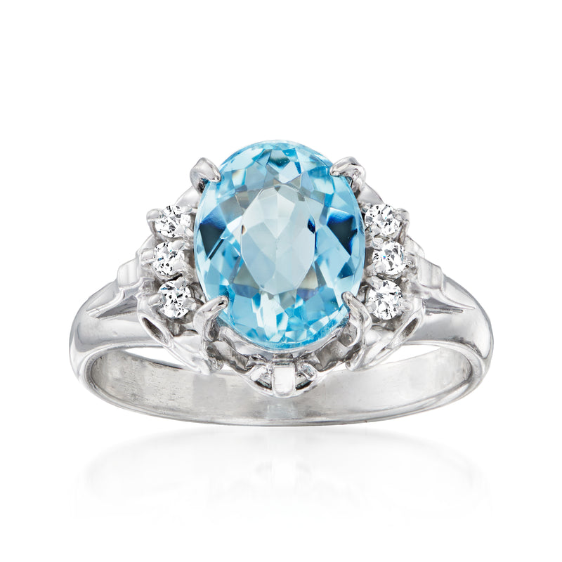 Platinum aquamarine oval ring with diamond side stones