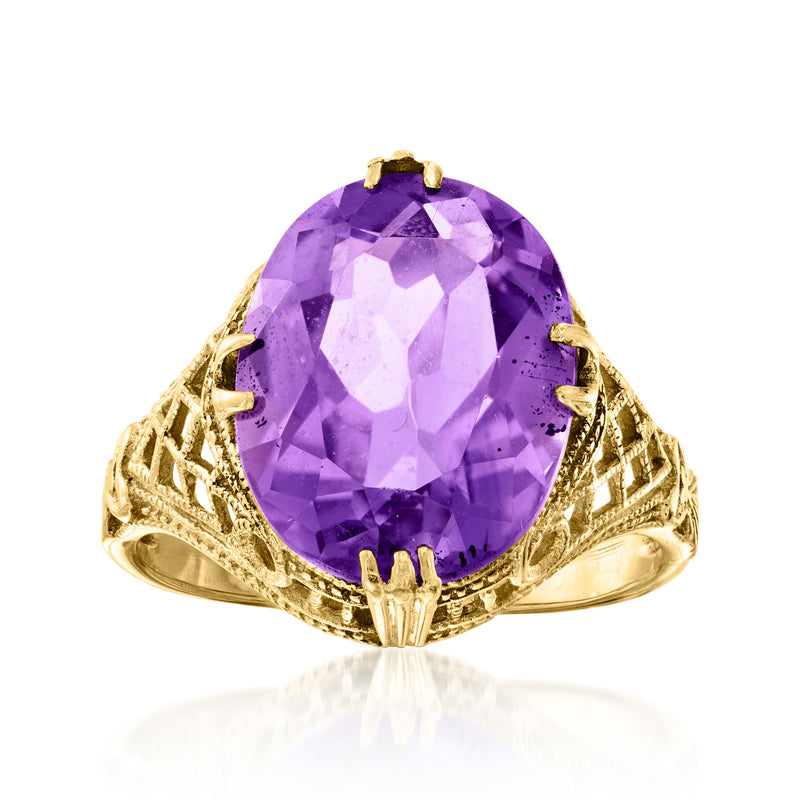 Vintage amethyst gemstone ring in 14k yellow gold with oval purple center