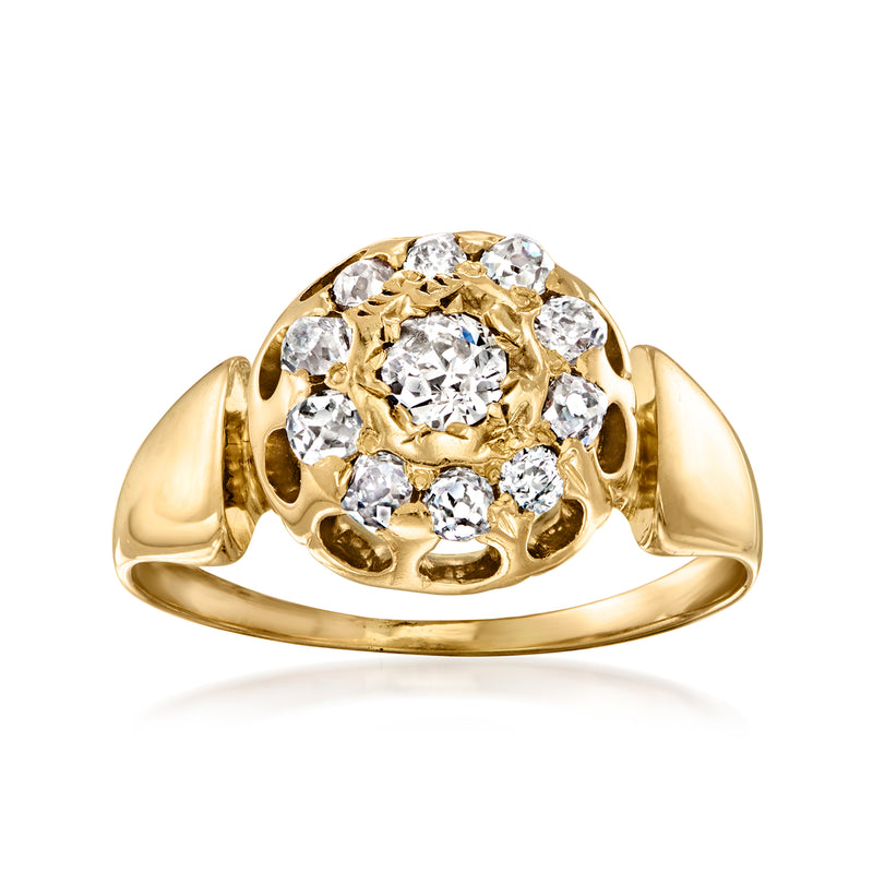 Vintage yellow gold diamond cluster ring with round bezel-set center stone and surrounding prongs
