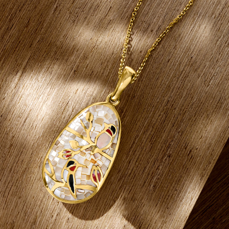Oval bird pendant on gold-tone chain with mother-of-pearl mosaic and red inlay