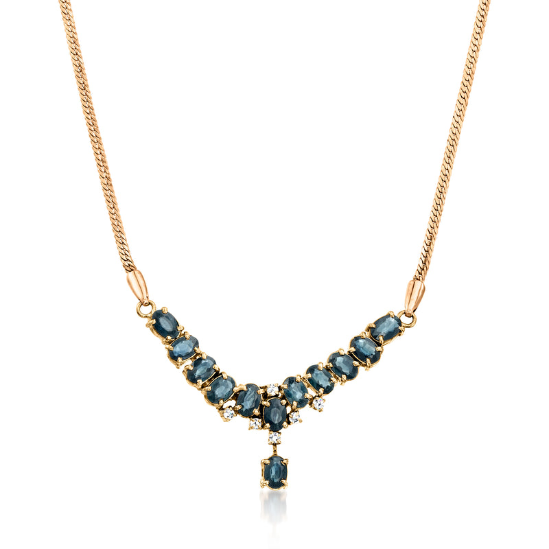 Yellow gold sapphire and diamond drop necklace with blue V-shaped stones and small drops