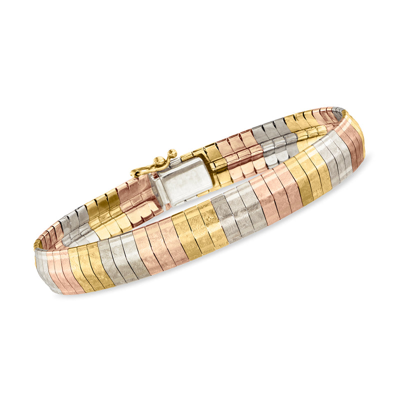 Vintage tri-colored gold Omega bracelet with hinged clasp, geometric bar segments.