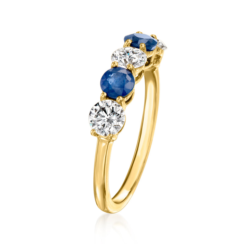 14kt yellow gold ring with blue sapphire and two round diamonds in prongs