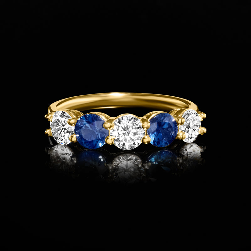 14kt yellow gold sapphire and diamond ring with oval center and side stones