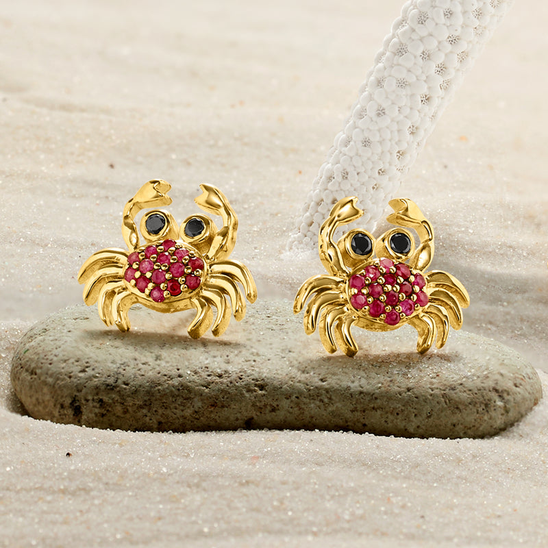 Gold crab stud earrings with red stone shell and black stone eyes
