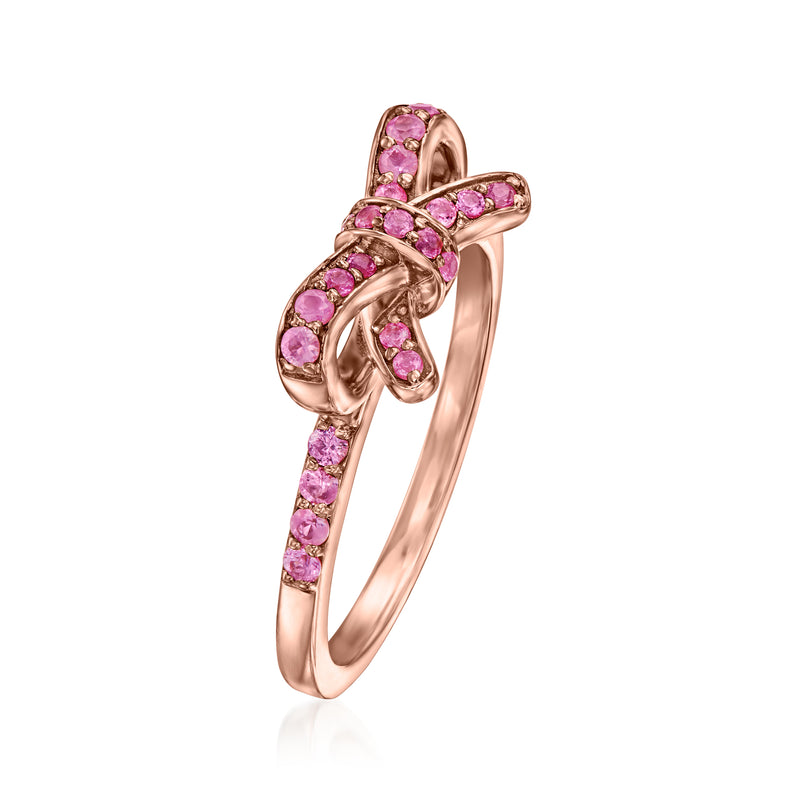 Pink sapphire bow ring in rose-gold tone, curved side view