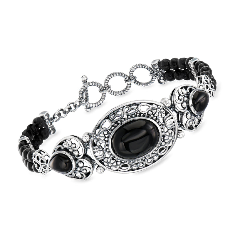 Sterling silver toggle bracelet with oval black onyx cabochons and ornate settings