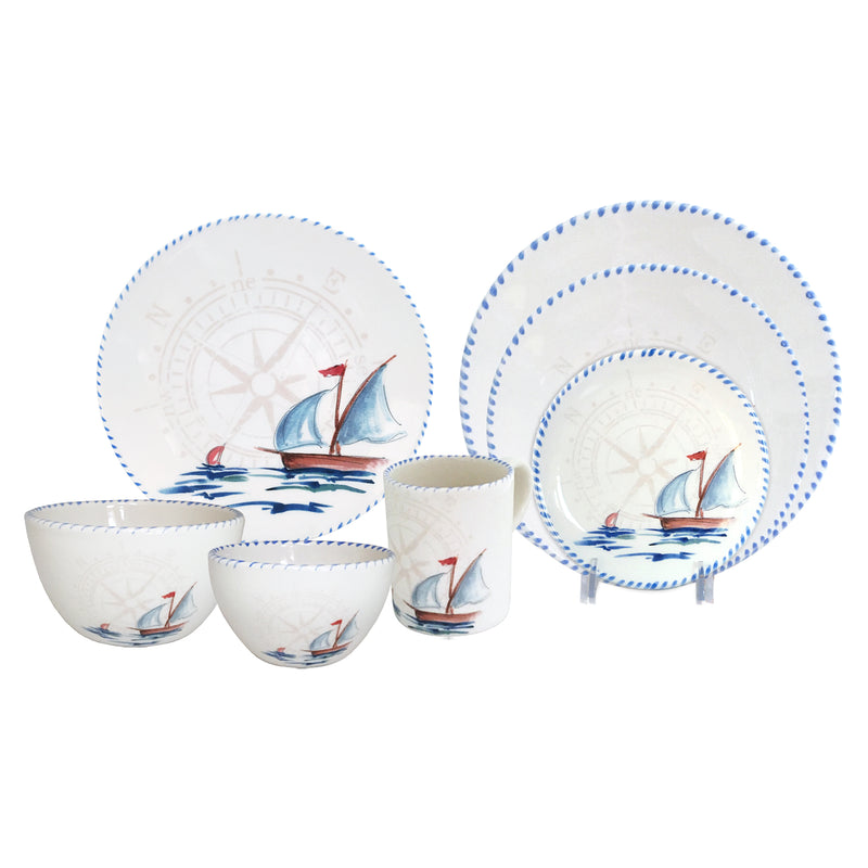 Ceramic dinnerware set with blue sailboat print: dinner plates, bowls, and mug
