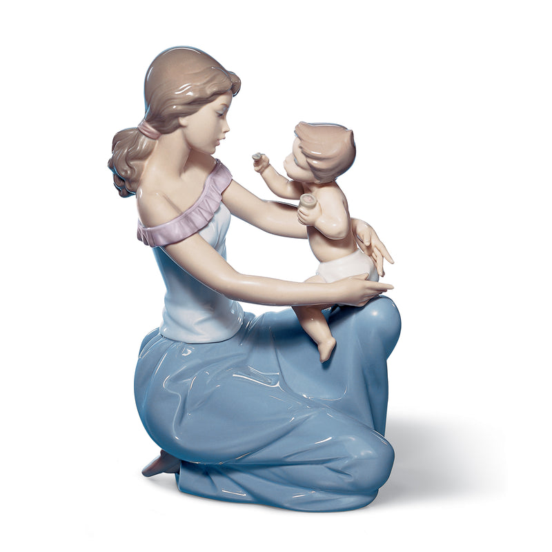 Lladro porcelain figurine, woman in blue dress holding baby in arms