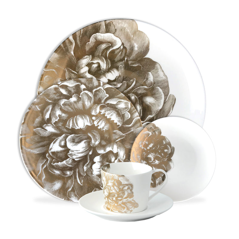 Caskata Peony Gold porcelain dinner plate, cup, and saucer with gold floral pattern on white