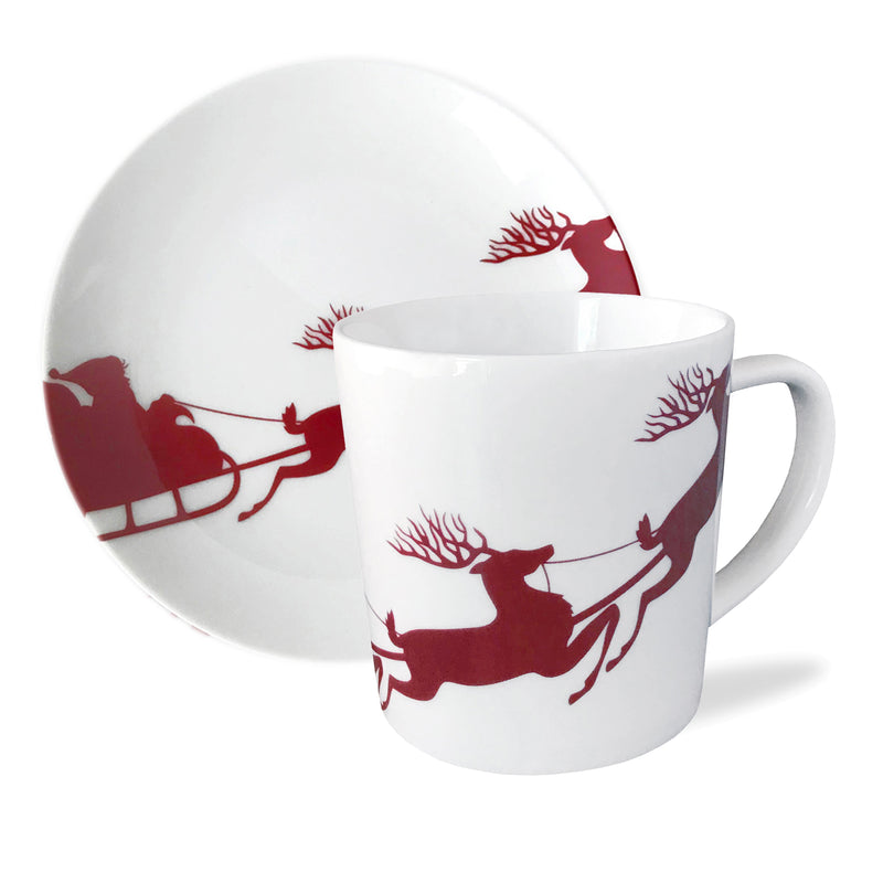 Caskata porcelain mug in white with red reindeer and sleigh pattern, curved handle