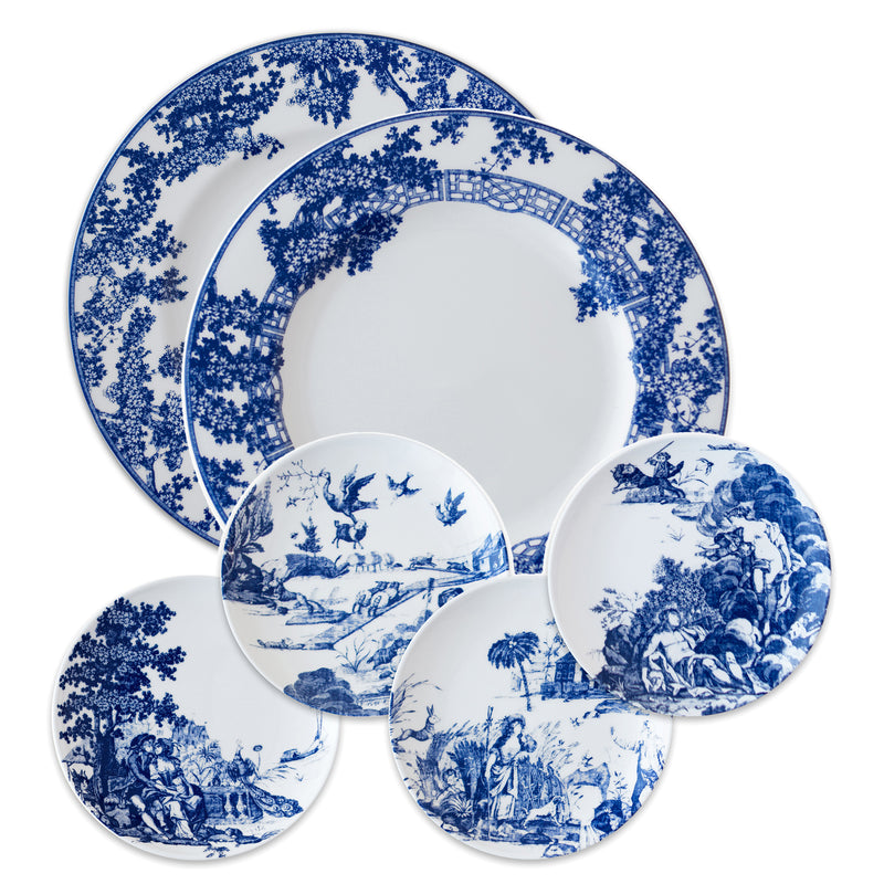 Blue and white porcelain dinnerware plates set with blue toile landscape pattern