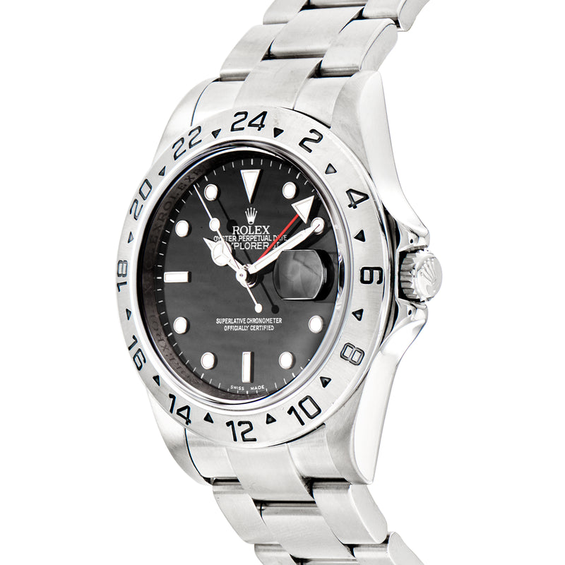 Stainless steel Rolex Explorer II watch with black dial, red seconds hand, angled view