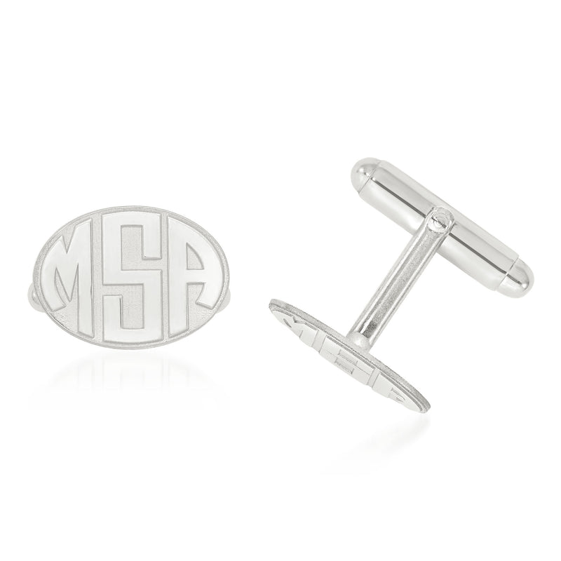 Sterling silver oval monogram cuff links with raised 'MH' letters