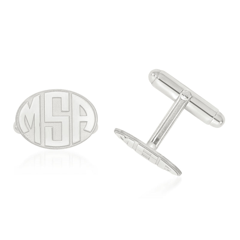 Oval white gold monogram cuff links with raised laser-cut letters