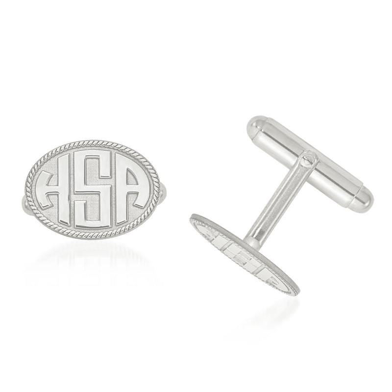 14kt white gold oval monogram cuff links with raised letters and decorative border