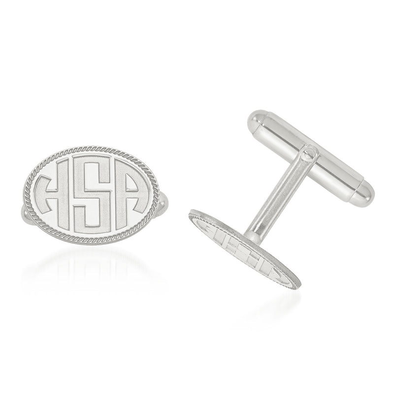Oval sterling silver cuff links with recessed letter H and engraved border